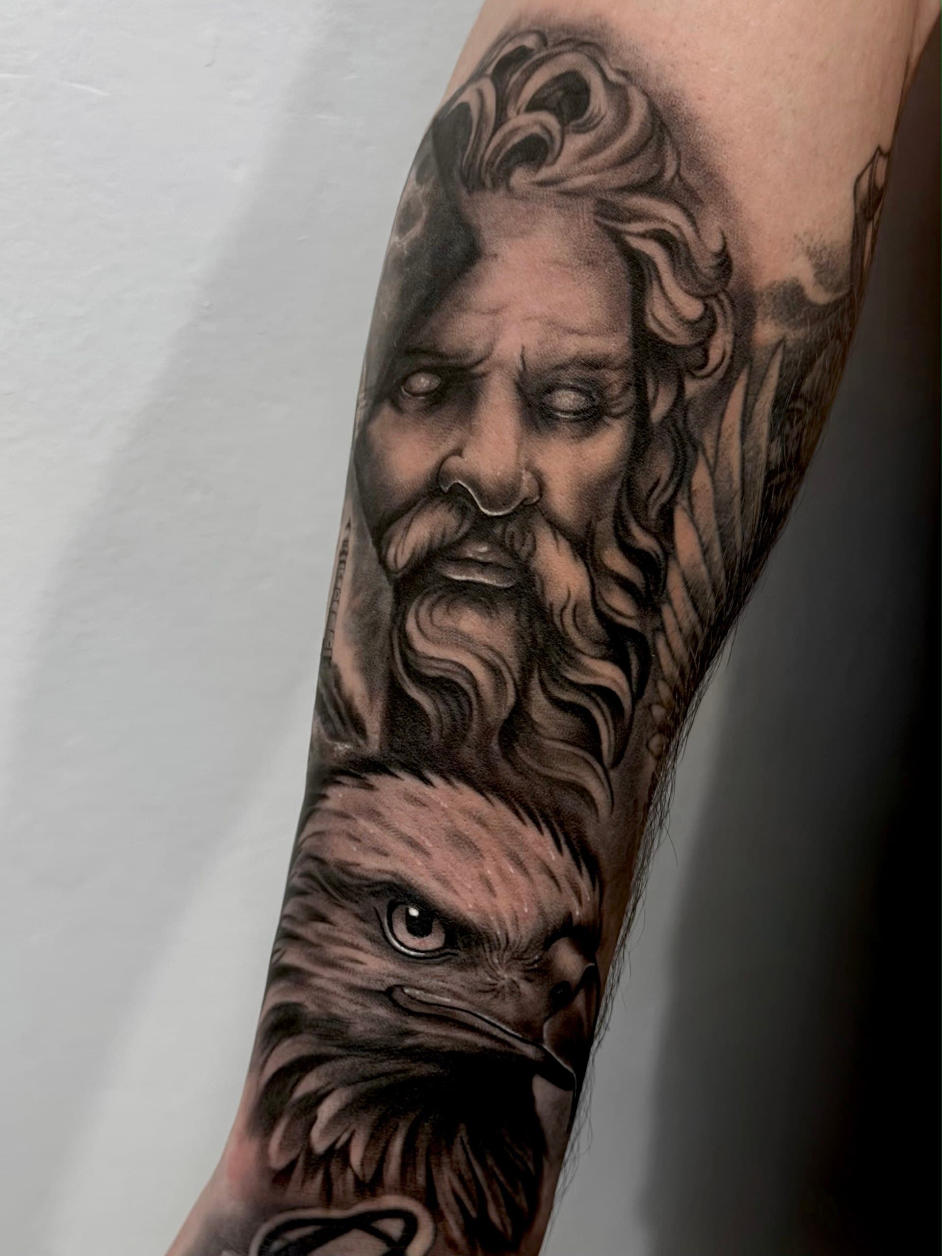Black and grey realism sleeve with Zeus and an eagle, LUX INK tattoo studio Batumi